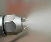 Ultrasonic air atomizing nozzle